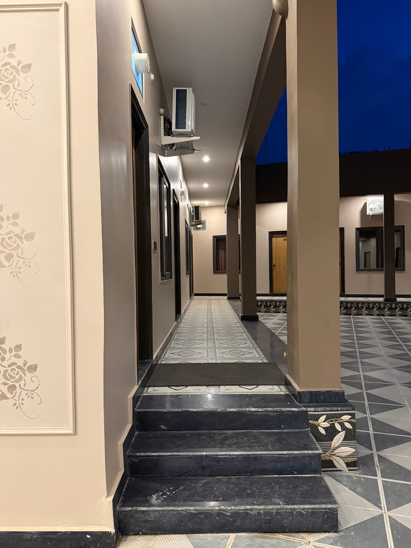 JSR Palace open corridor and rooftop area at dusk, Pushkar
